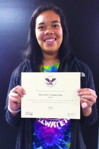 Mannford student Destiny Carpenter poses with her certificate.