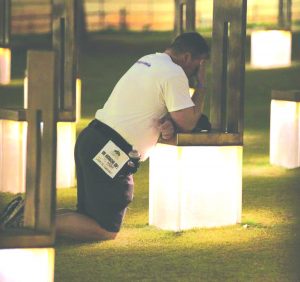 Kyle Genzer remembering his mother at her memorial chair at the Oklahoma City Bombing Memorial before a marathon.
