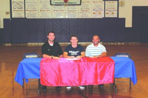 Randy Daugherty signs on to play basketball with St. Gregory's College.