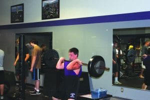 MHS student lifting weights.