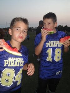 Two Pirates enjoying the sweet taste of watermelon.
