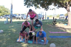 Bootcampers build a pyramid it during one minute workouts.