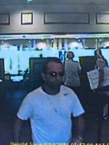 Second suspect sought in stolen checks crime.