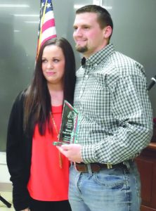 Clint Winn and Shea McMonigle accept Business of the Year Award at the Annual Chamber Banquet.