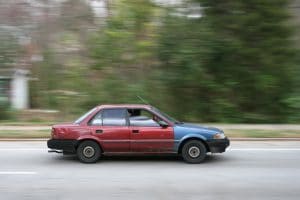 2009-03-11_Beat_up_car_driving_in_Durham